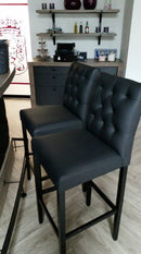 Zwarte barstoel met capitons